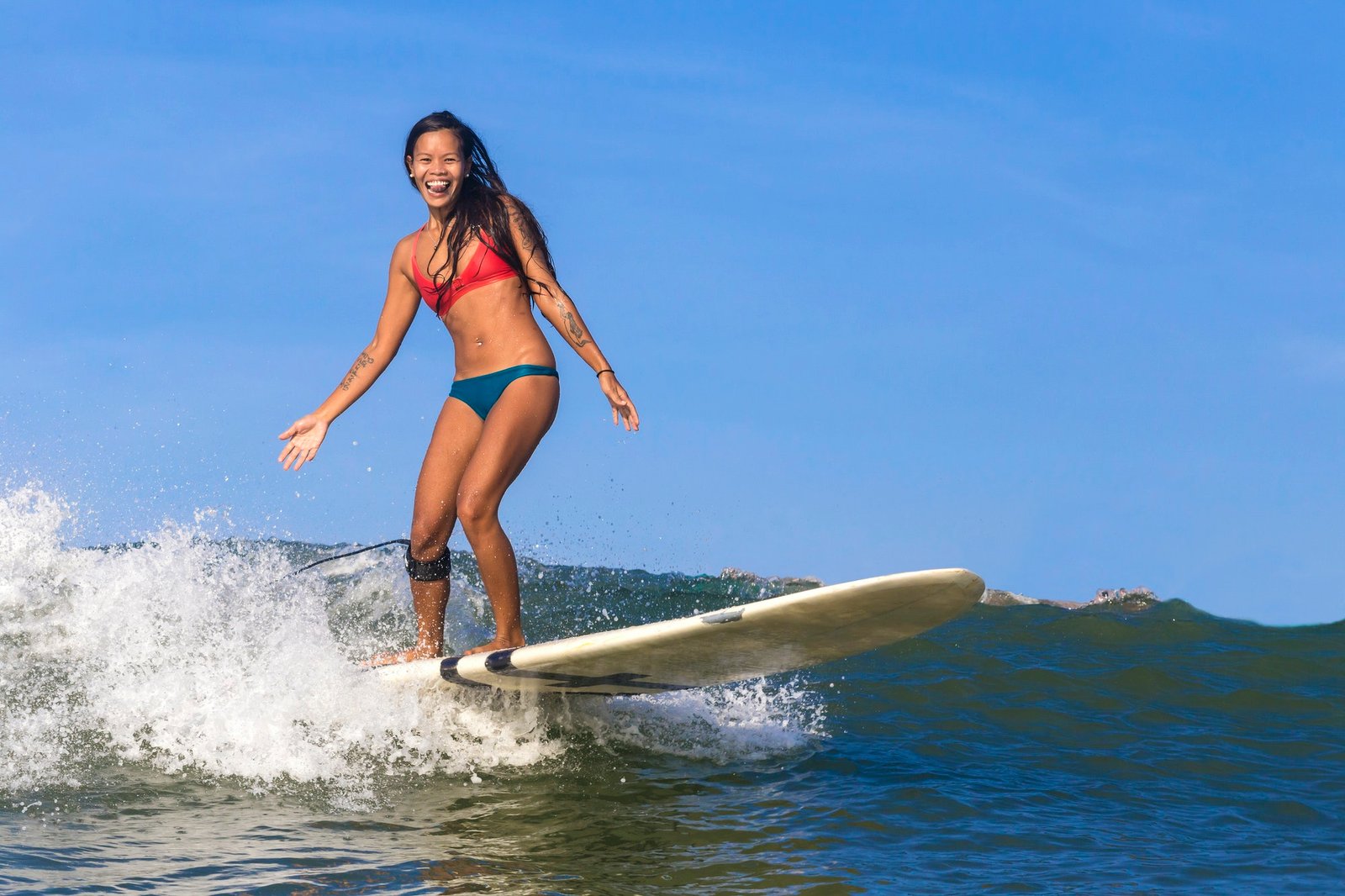 Indonesia, Bali, woman surfing