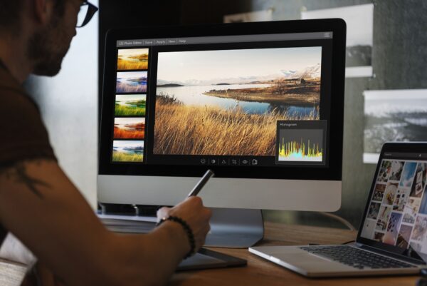 "Professional video editor crafting commercial drone footage for brand marketing and business promotion in Bali."
