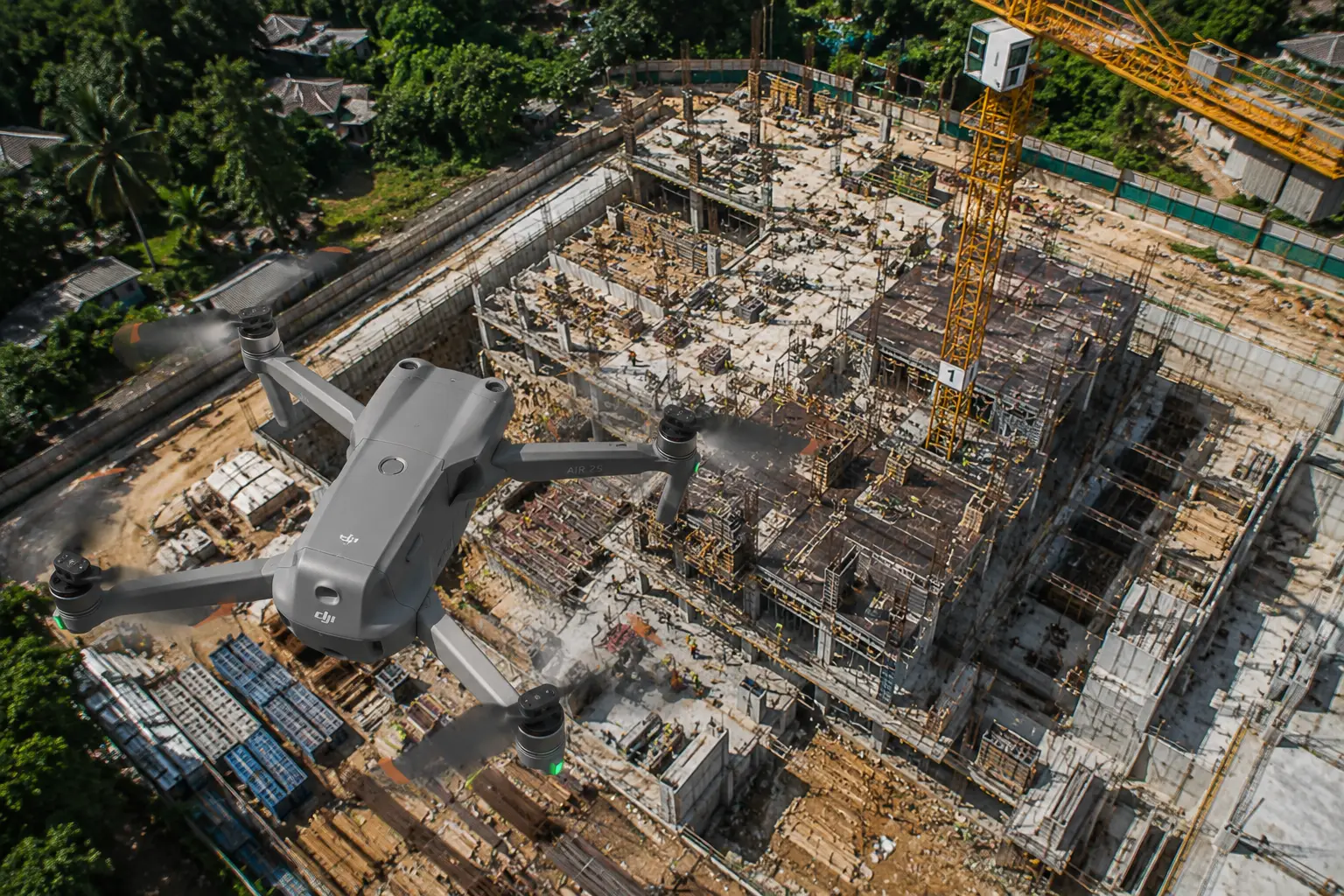 Professional drone conducting aerial inspection of a large construction project in Bali, capturing progress monitoring, site surveys, and commercial drone videography from above.
